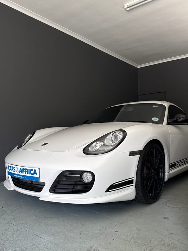 Car enthusiast documents classic sports cars in Cape Town