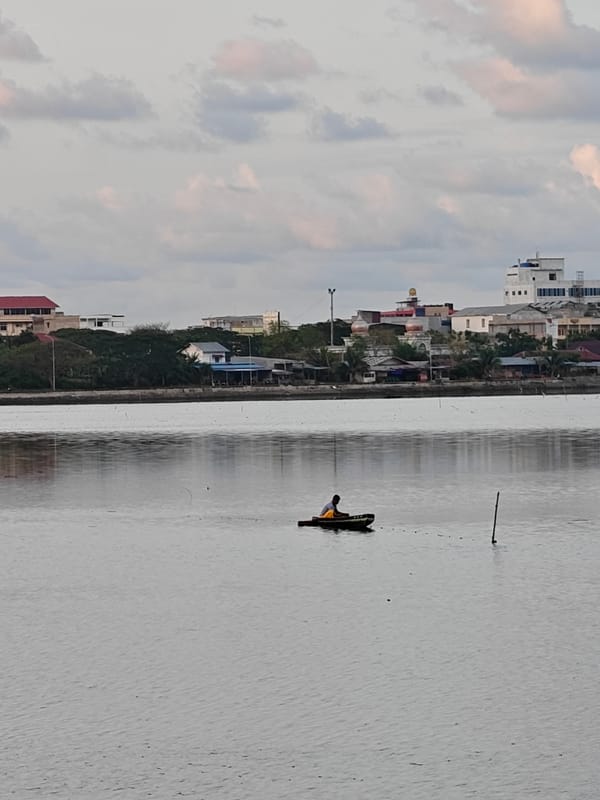 Evening fishing and sunset captured in Lhokseumawe waterway