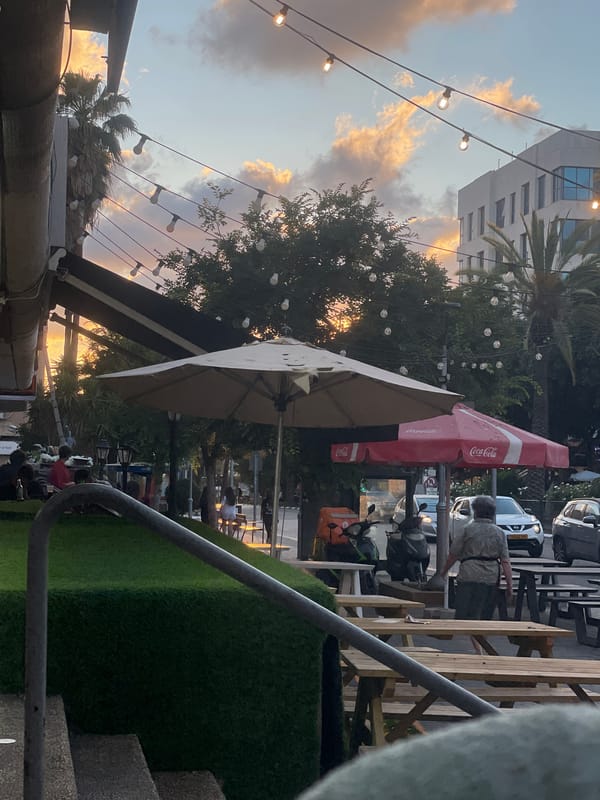 Sunset dining scene captured in Raanana, Israel restaurant district