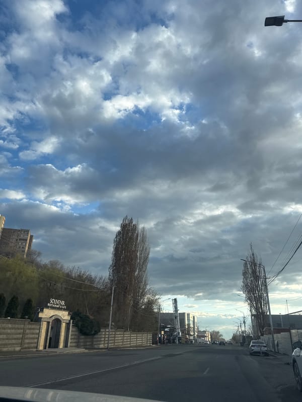 Street scene captured in Yerevan showing restaurant signage