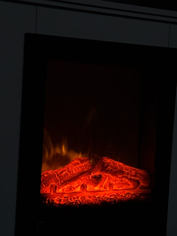 Electric fireplace glows in Bulgarian home