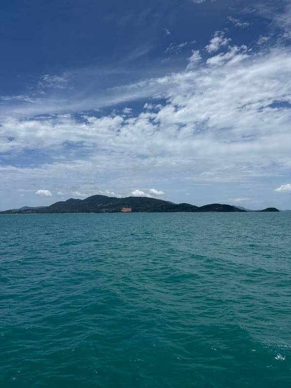 Floating in shallow surf off Ko Samui on a calm morning