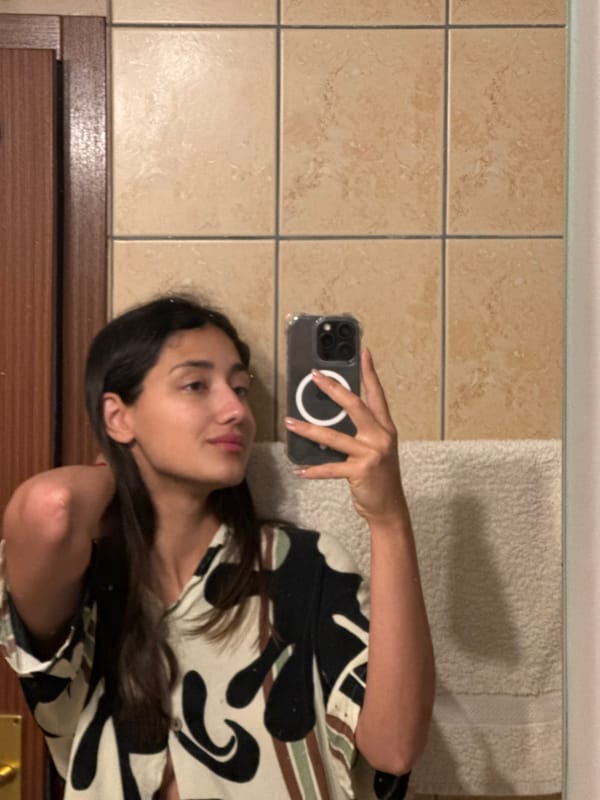 Woman takes bathroom selfie in Montenegro village