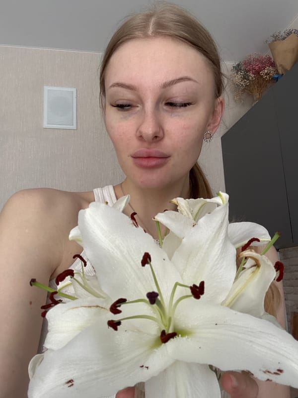 Woman photographed with white lilies in Perm morning session