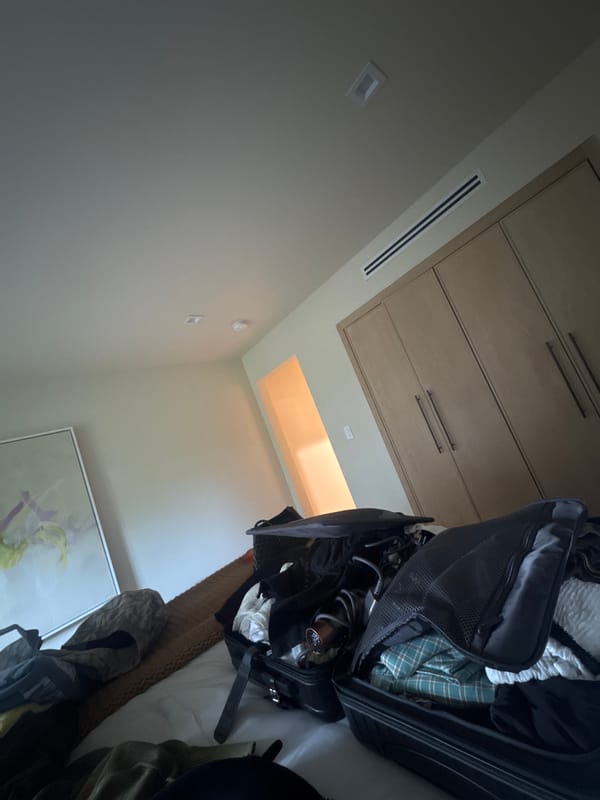 Bedroom interior with wooden cabinet photographed in Los Angeles