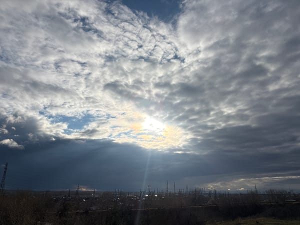 Dramatic skies captured over Chaikovsky industrial landscape and Kama River