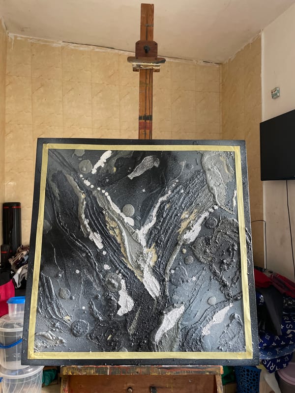 Abstract painting displayed on easel in Ado, Nigeria