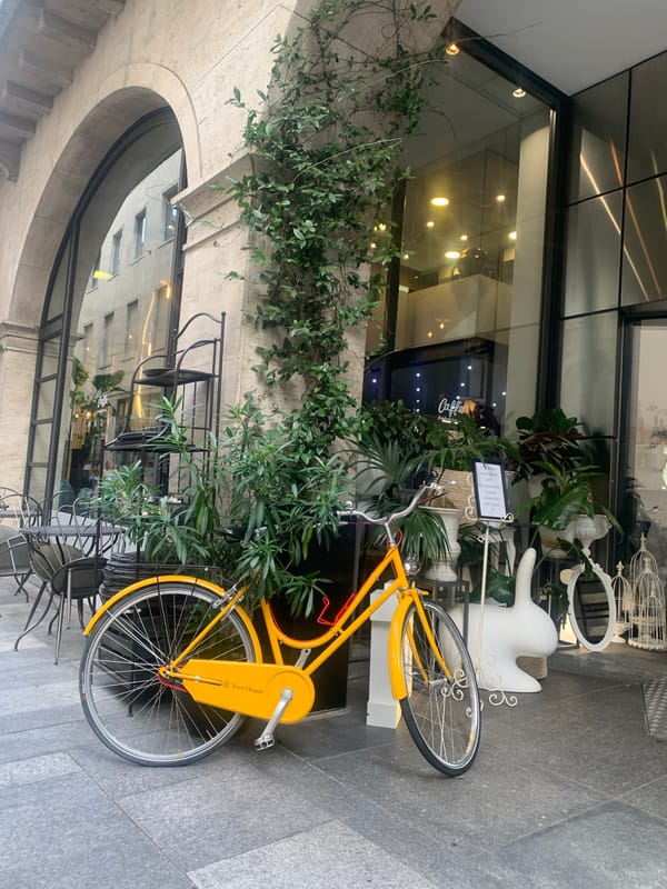 Quirky street details along a Lugano sidewalk on a summer afternoon