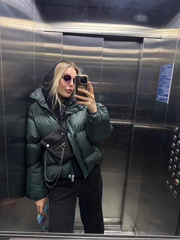 Woman takes selfie in elevator in Krasnoyarsk, Russia
