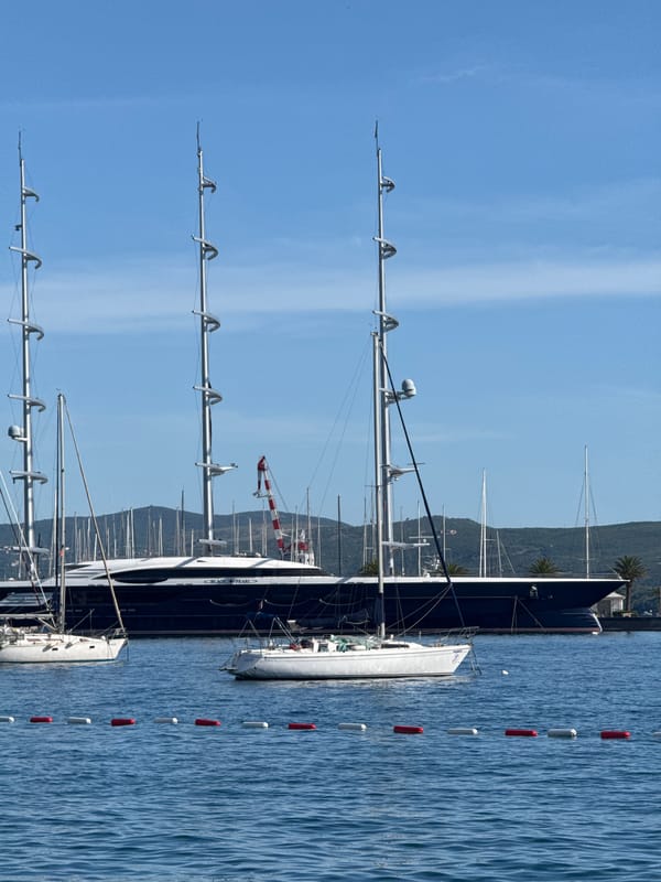 Busy boating day in Tivat harbor features superyacht, recreational vessels