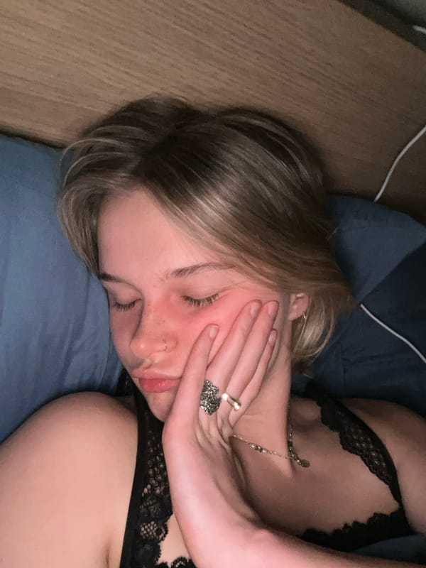 Woman resting on blue pillow captured in Vancouver