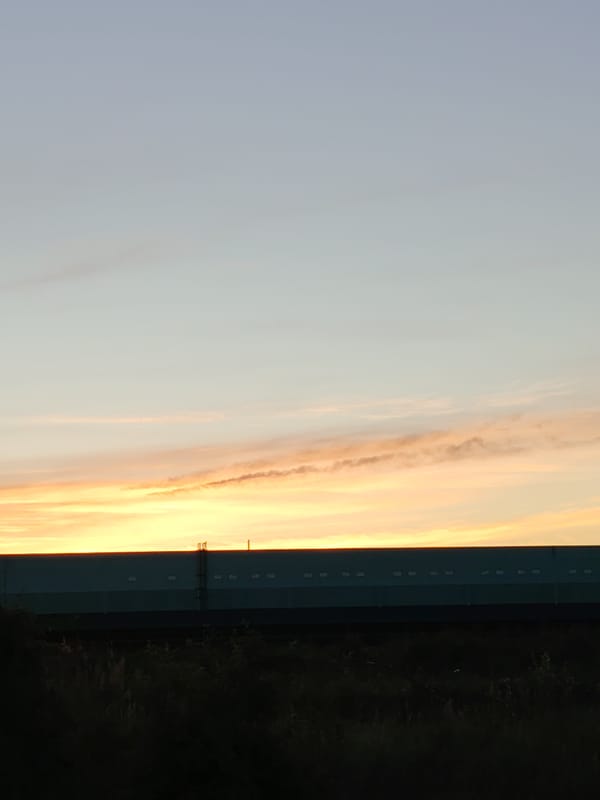 Warehouse and loading dock activity at dawn or dusk