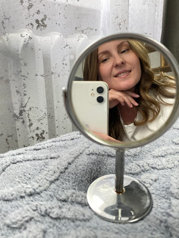 Woman takes mirror selfies in Noviy, Russia morning routine