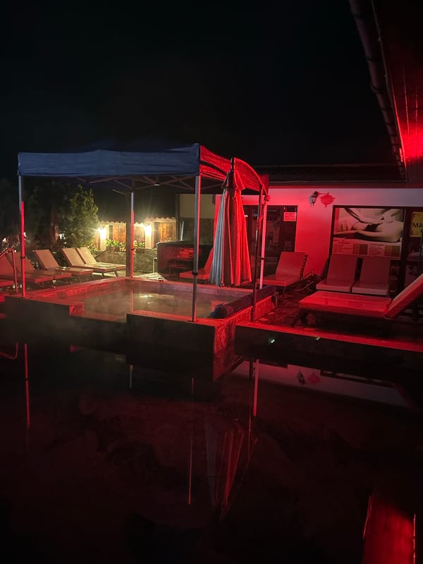 Empty thermal spa glows red at night in Bulgaria