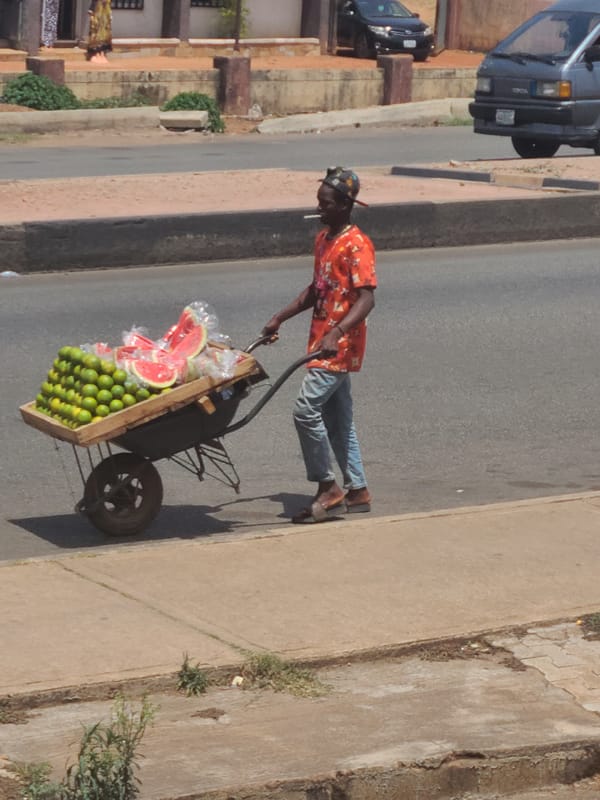 Daily life unfolds across sunny Jos streets