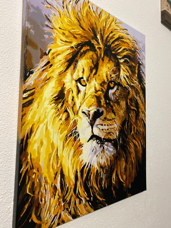Cozy home evening with a cat, candle, and wall art