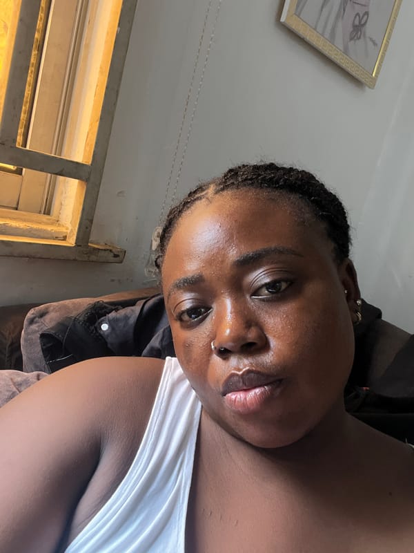 Relaxed afternoon at home in Abuja, phone in hand