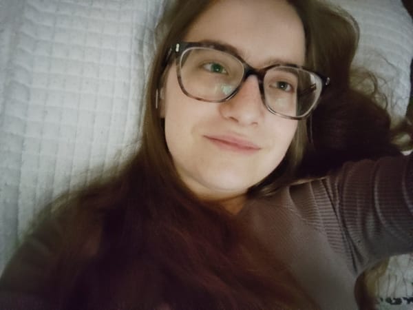 Woman resting on bed observed in Sofia