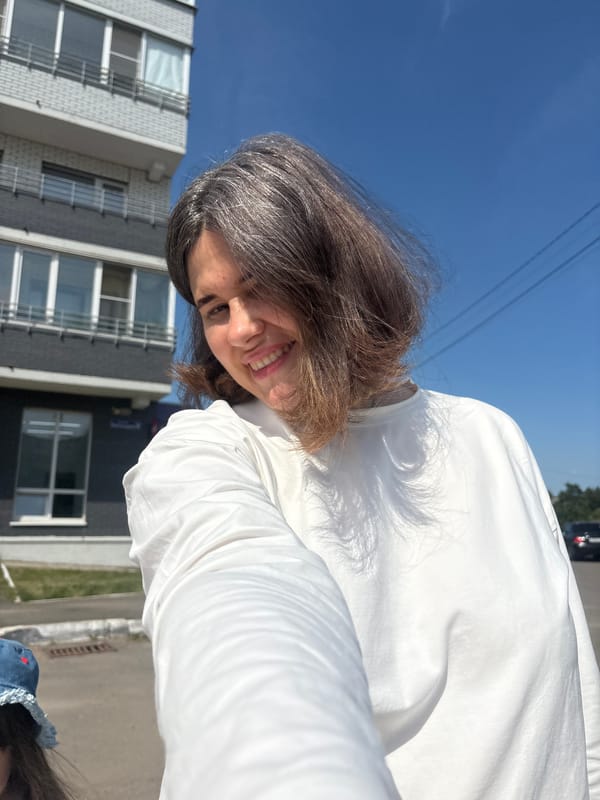 Summer selfies outside a Chaikovsky apartment block