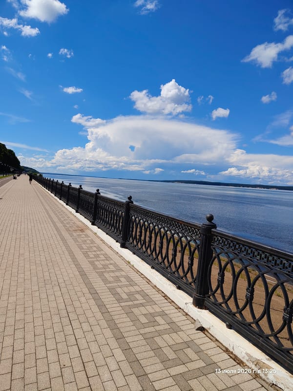 Sunny afternoon along a busy waterfront promenade