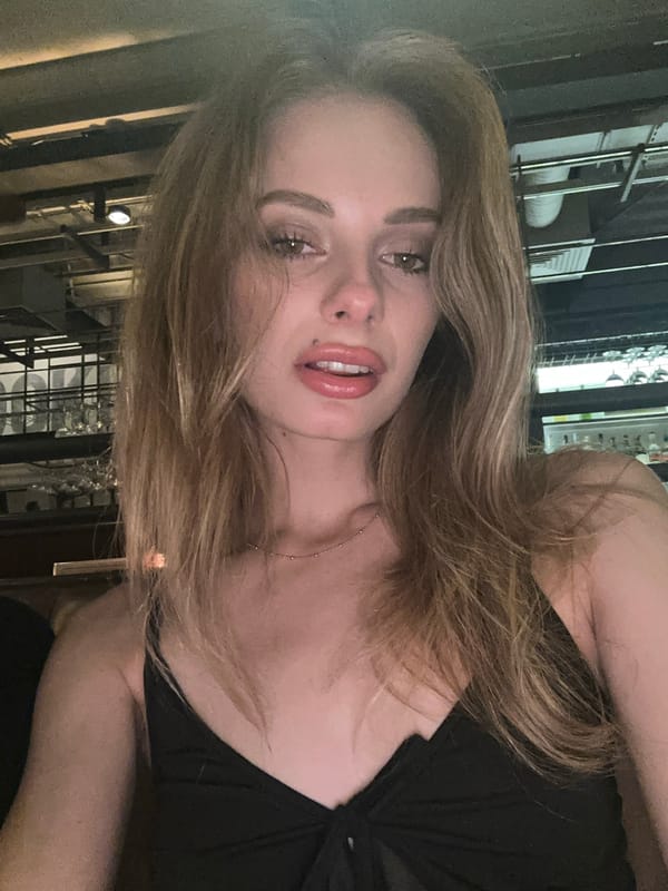 Woman takes selfies at Warsaw venues Friday evening
