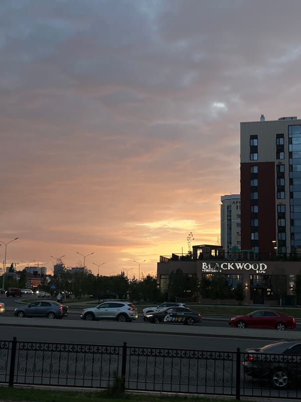 Evening street scene captured in Astana with sunset glow