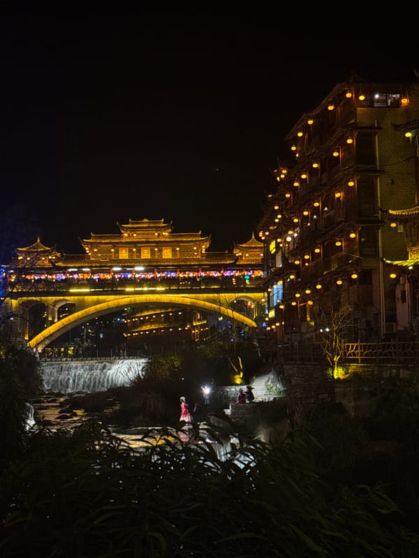 Furong Ancient Town's waterfall and traditional architecture documented by witnesses