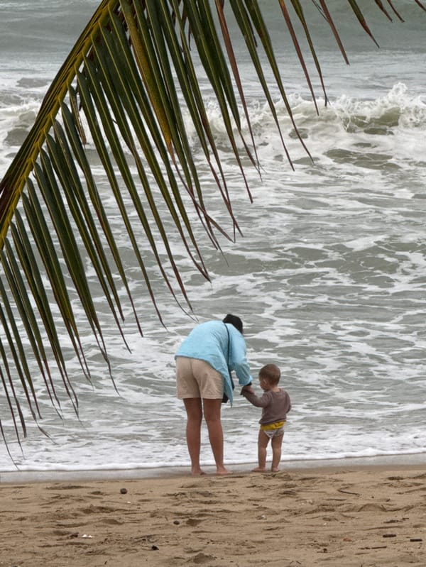 Overcast morning beach activity observed in Nha Trang, Vietnam