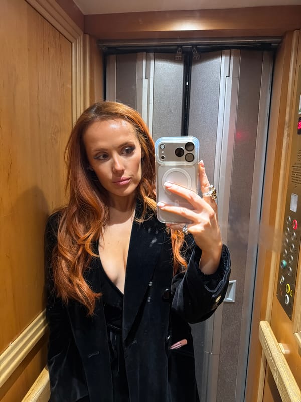Woman takes elevator selfie in Paris early morning