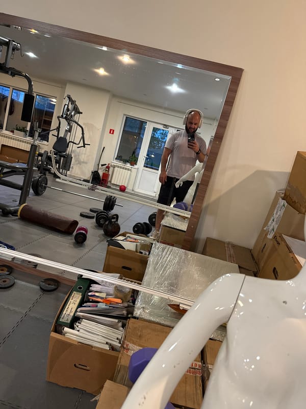 Man Takes Selfies in Home Gym During Evening Workout