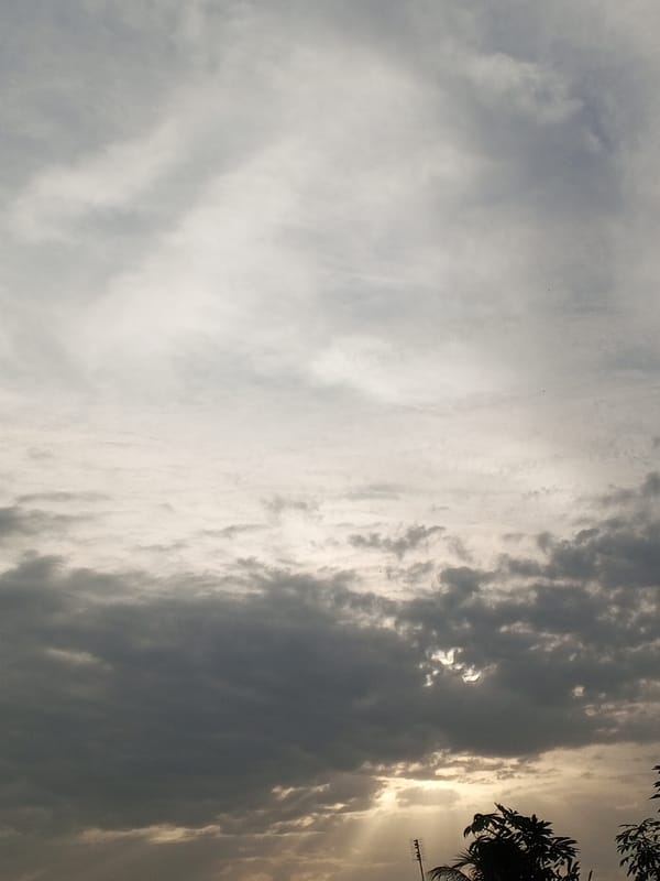 Dramatic evening skies and street life documented in Badagry
