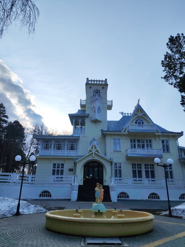 Tourists photograph historic Dacha Bashenina landmark in Sarapul