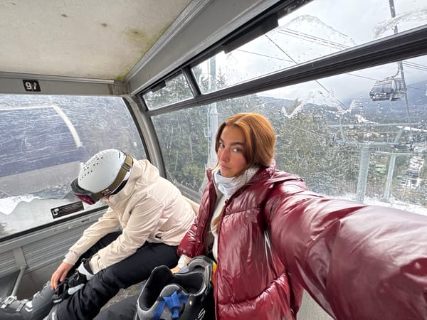 Skiers prepare equipment inside Whistler gondola