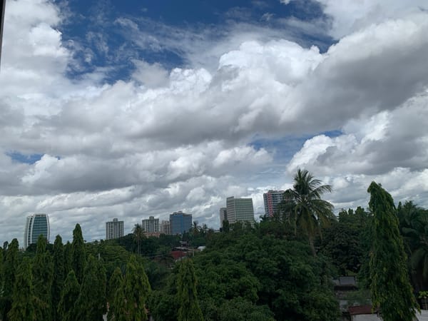 Woman photographed multiple times in polka dot top, Dar es Salaam