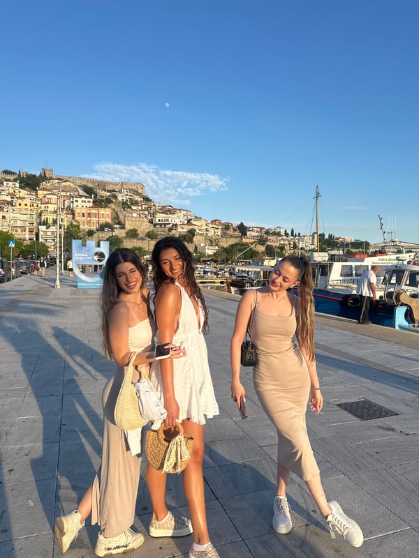 Visitors enjoy sunny afternoon at Kavala Greece harbor promenade