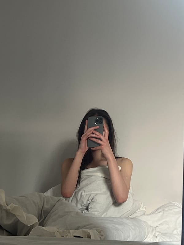 Person Takes Late Night Mirror Selfies in Ternopil Bedroom