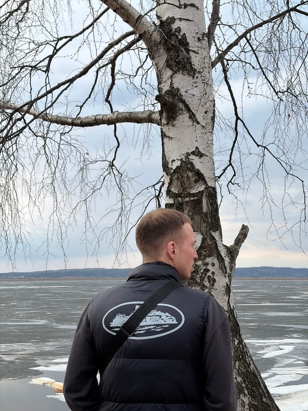 Spring day activities along frozen Kama River in Chaikovsky