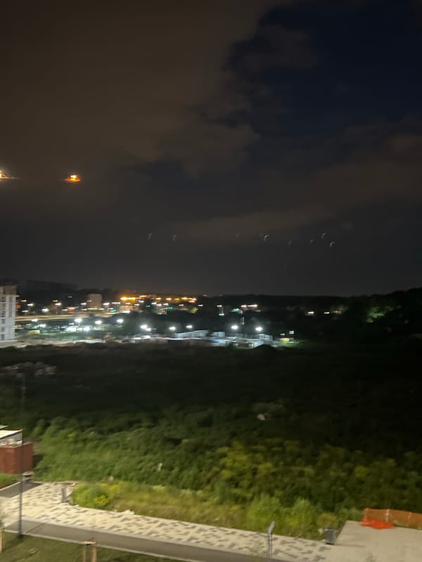 Nighttime views over a Yekaterinburg construction site and city streets