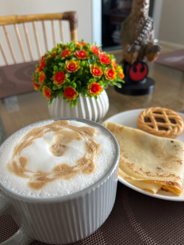 Cappuccino and crepes on a Bitonto breakfast table