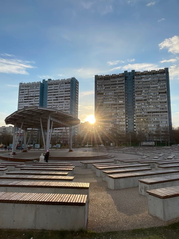 Visitor explores Moscow park amphitheater during afternoon visit