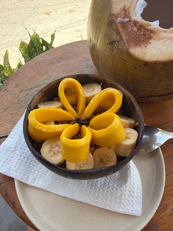 Early morning breakfast captured at wooden table in General Luna
