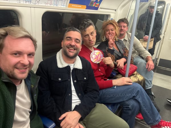 Seven people travel together on London Underground train