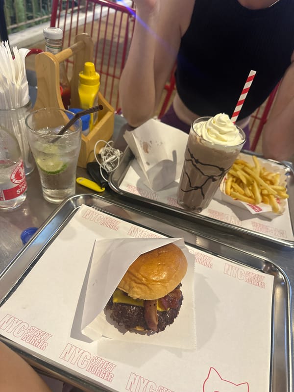 Woman enjoys burger meal at NYC Street Burger Thailand