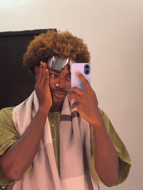 Person takes mirror selfies indoors in Igboefon, Nigeria
