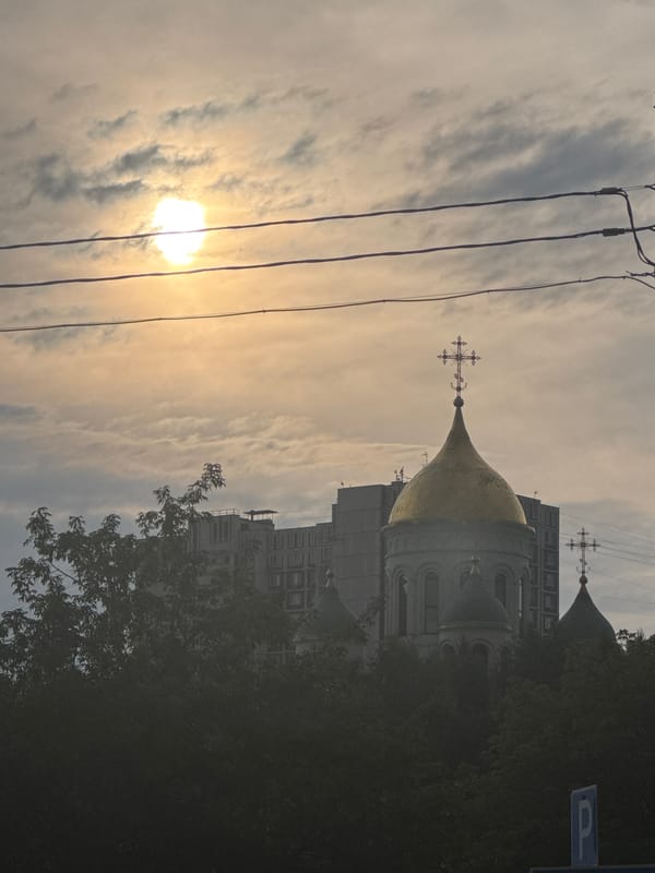 Golden domes and dachshunds near a Moscow waterfront