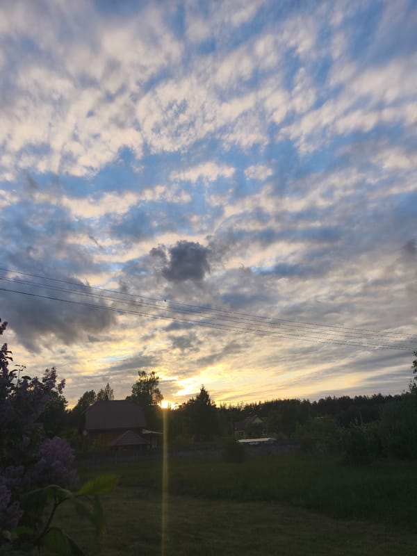 Evening sunset and yard work documented in Парэчча, Belarus