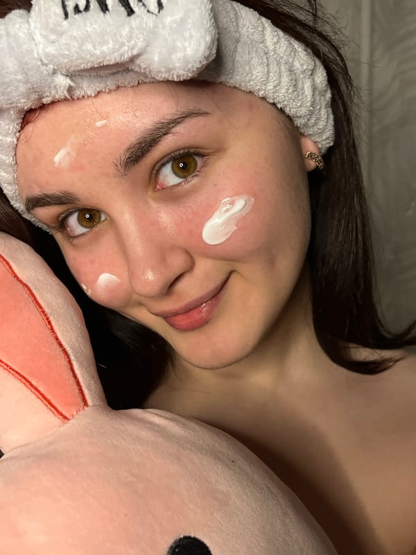 Woman documents beauty routine with flowers in Neftekamsk