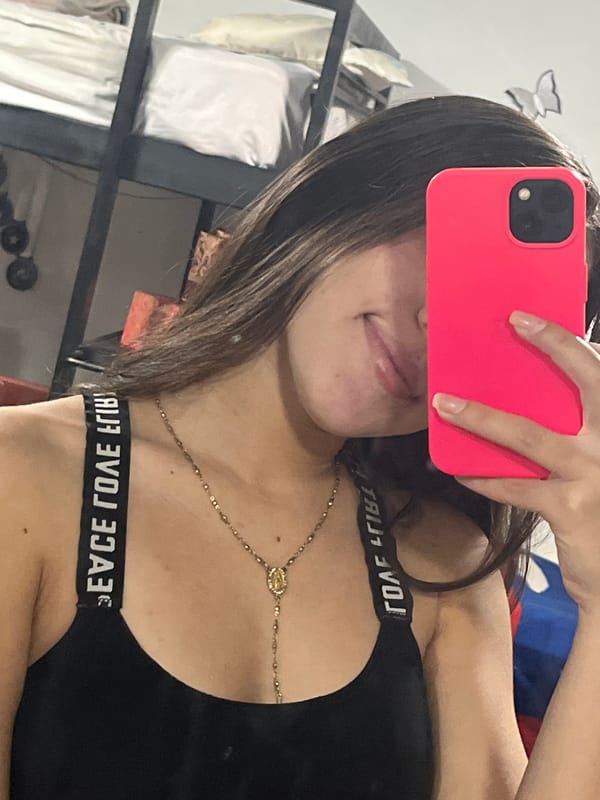 Mirror selfies with pink phone captured in Juan Griego