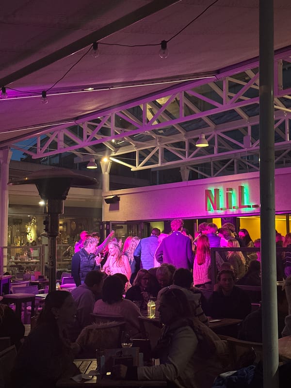 Evening crowd gathers at NFL-themed outdoor venue in Kiel