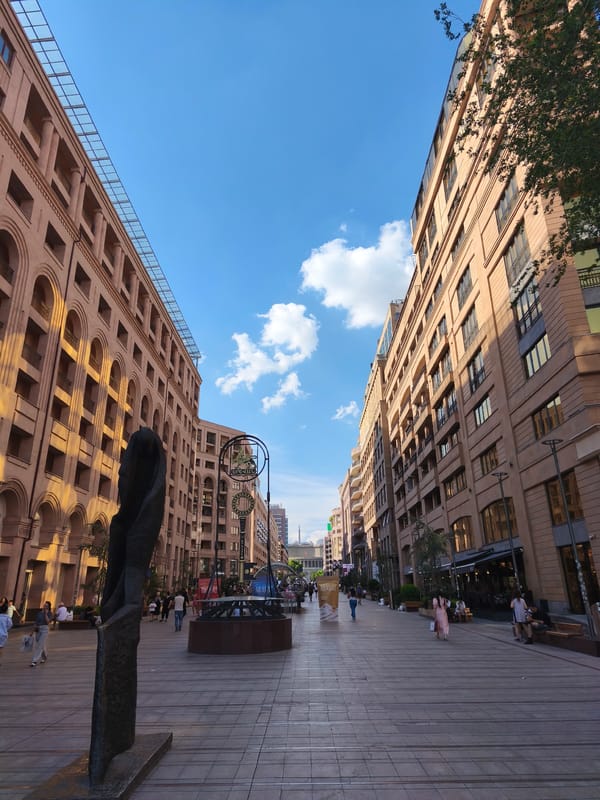 Ornate city streets and Mount Ararat visible on the horizon
